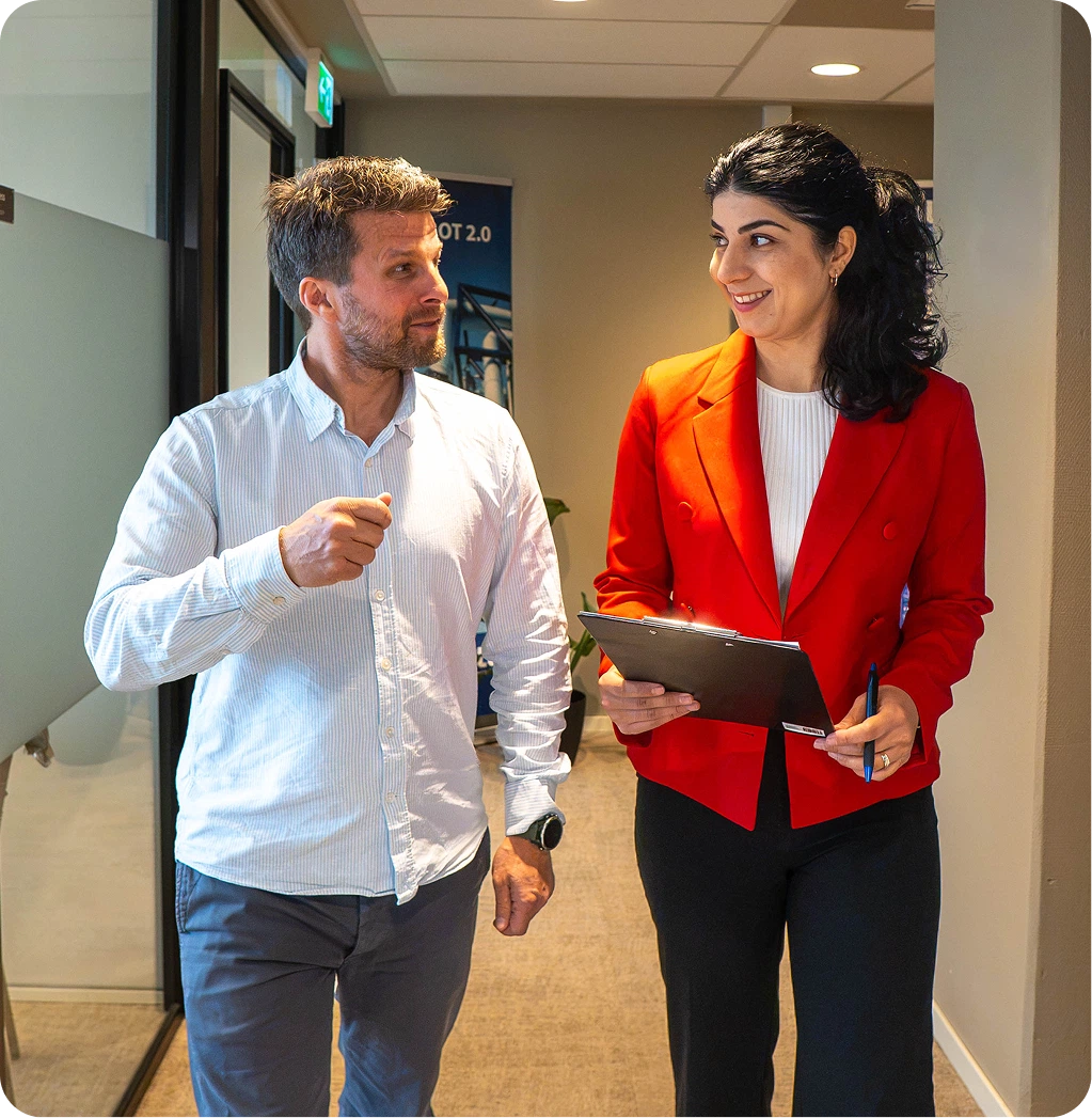 bluZenit team members discussing an asset integrity project in the office
